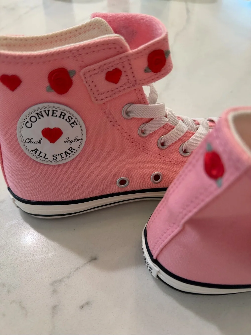 Converse Pink High-Top Sneakers with Red Heart Details
